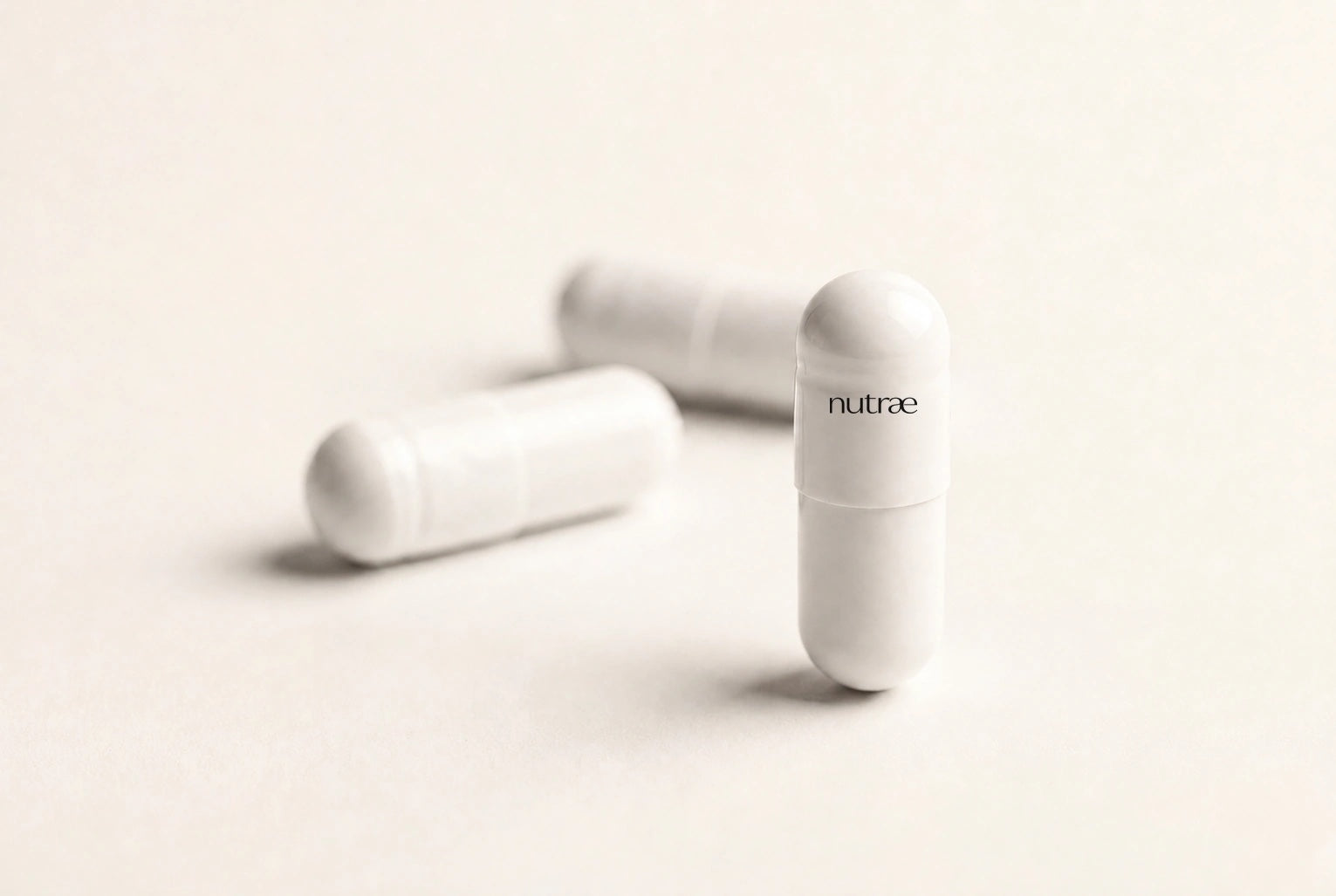 Nutrae white pullulan capsules printed with the nutrae wordmark